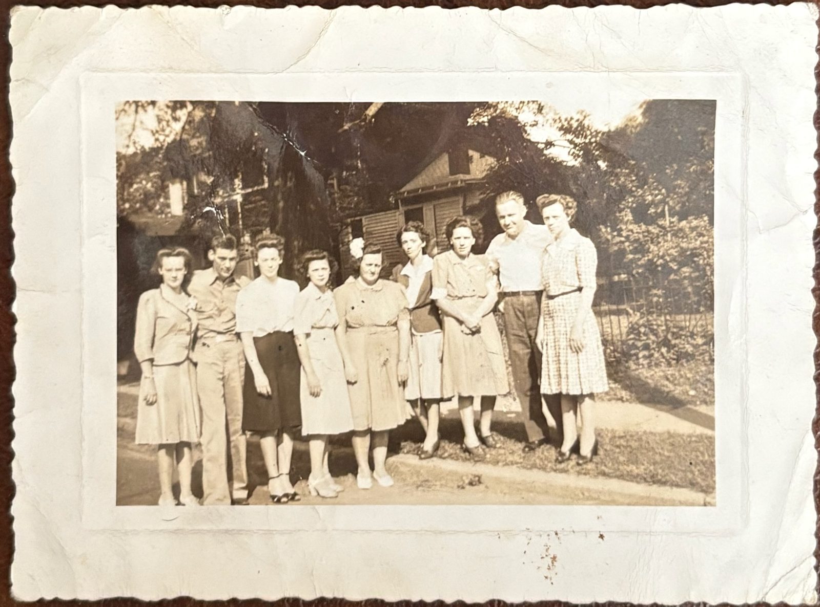 The nine Butler siblings together, summer 1943. George is the lean young man, second from left. Left to right: Lillian, George, Marian, Alice, Marge, Katherine, Sarah, John, Ann.