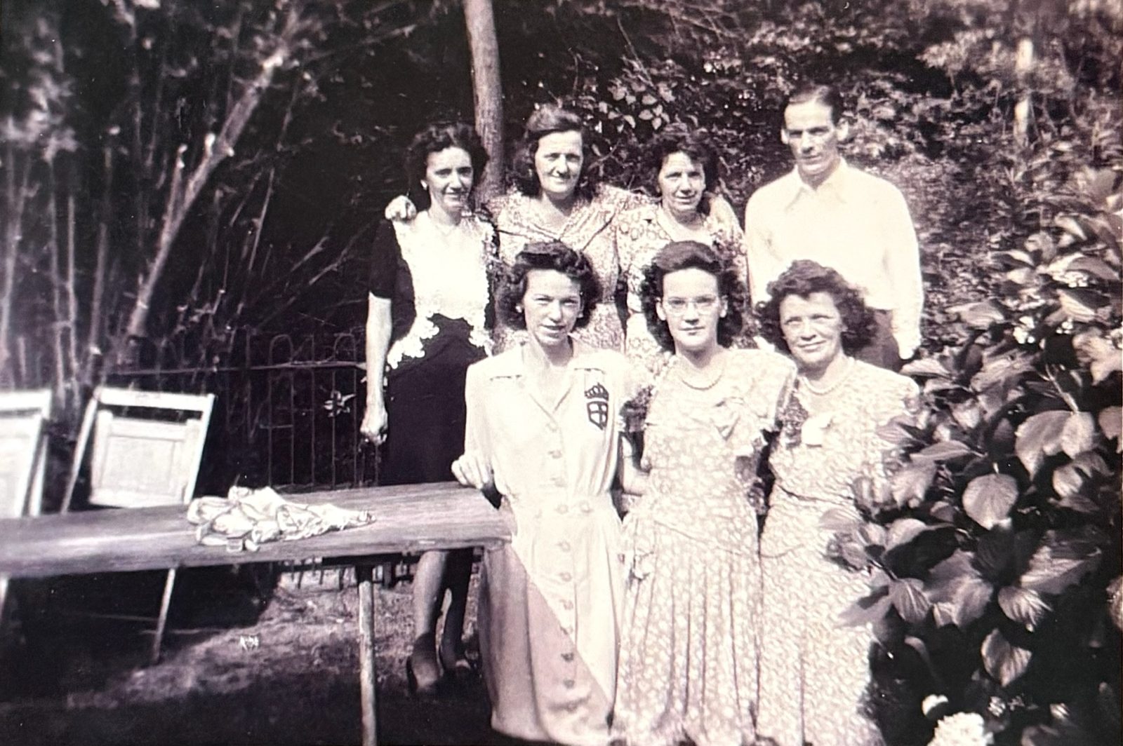 A garden gathering of the Butler sisters with George (back row, right).