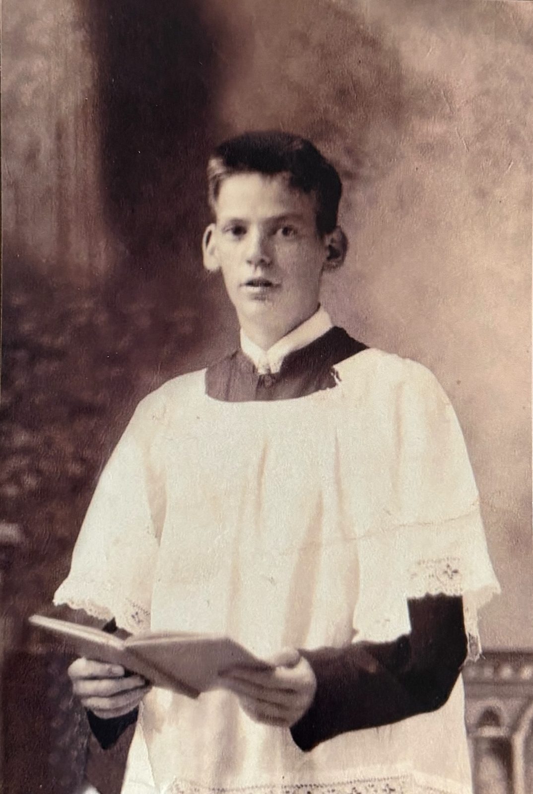 George as an altar boy. He kept up churchgoing all through the war — a priest, likely Father Doyle, recurs throughout the letters.